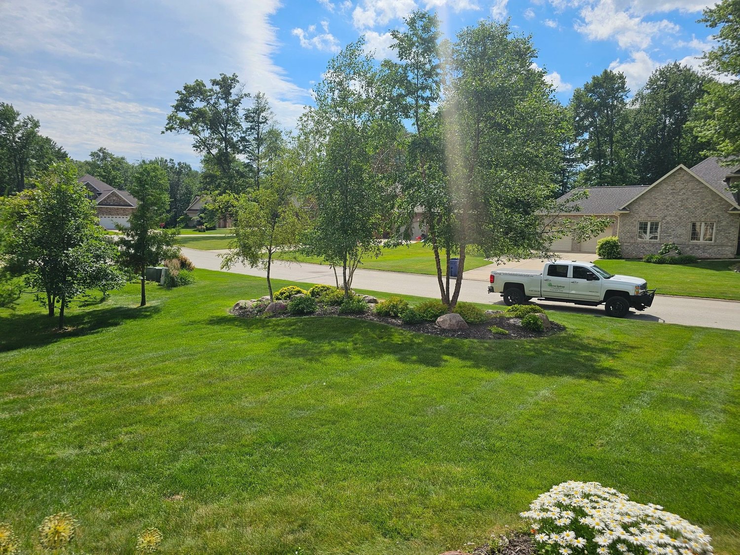 Anderson Landscape truck alongside a landscaped property